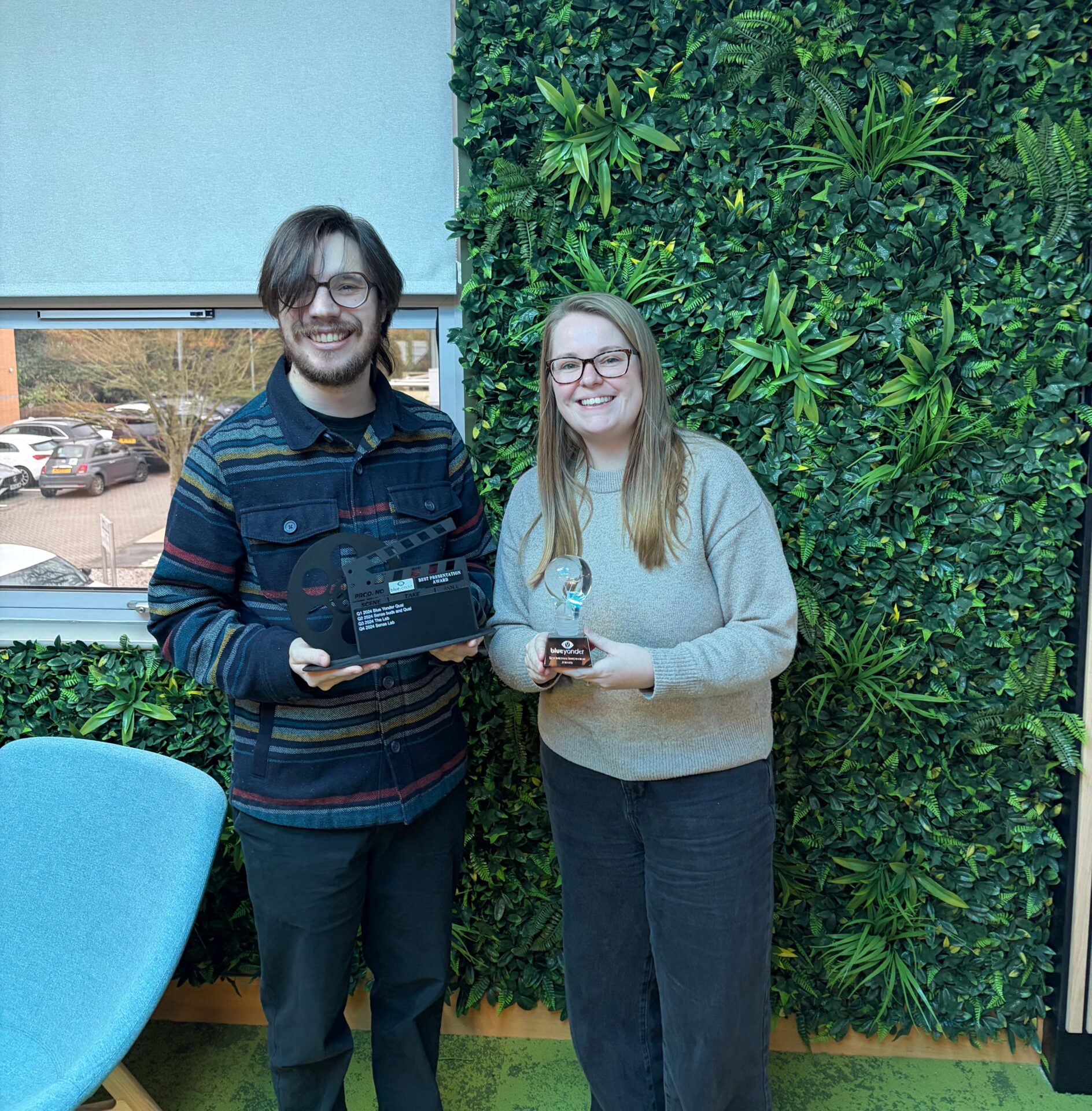 Tom Wing, Senior Data Analyst receiving both awards on behalf of the Oracle, Data Science team, and presented by Hannah Over, Innovation Associate Director.